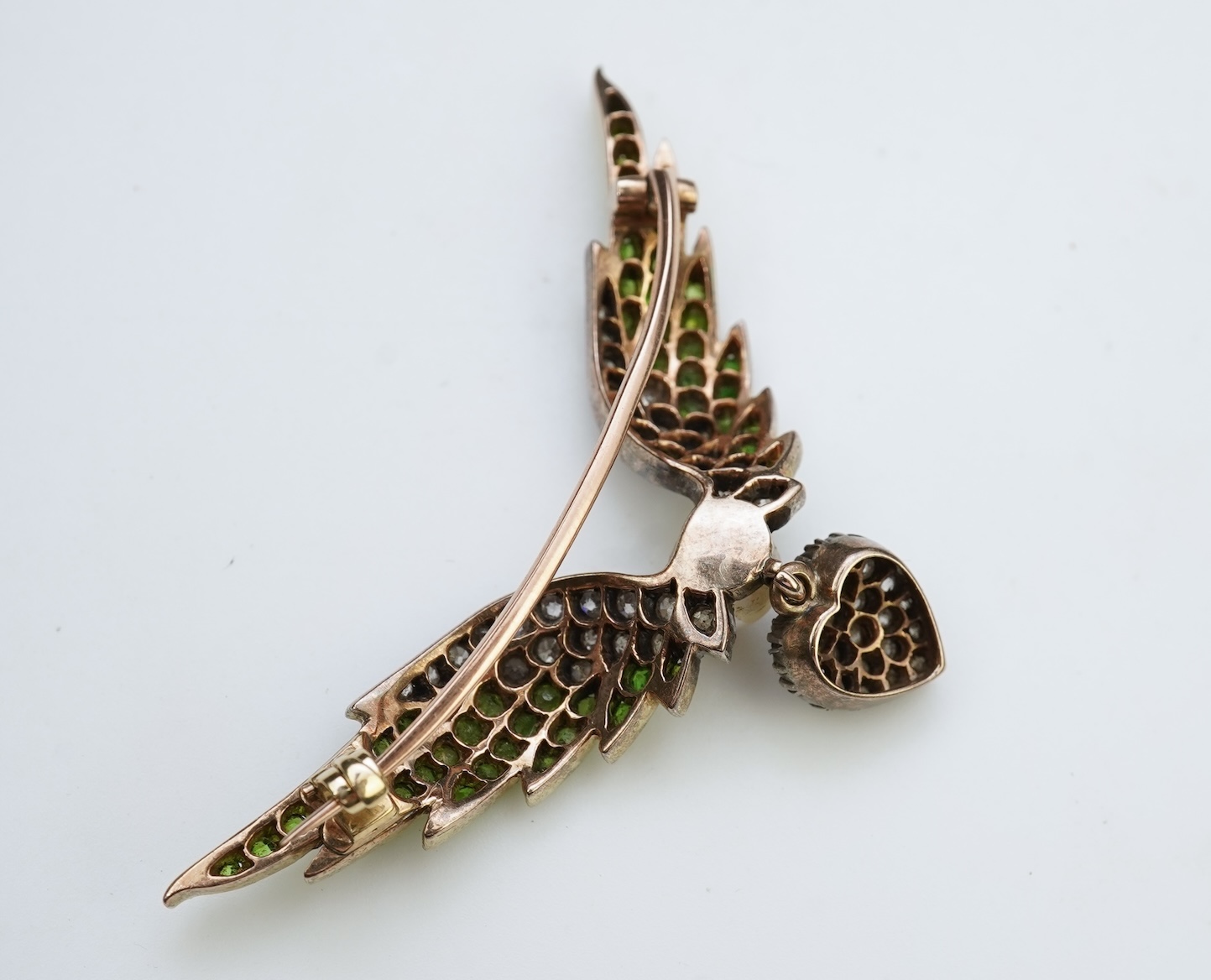 An attractive late Victorian demantoid garnet, pearl and diamond brooch, circa 1900